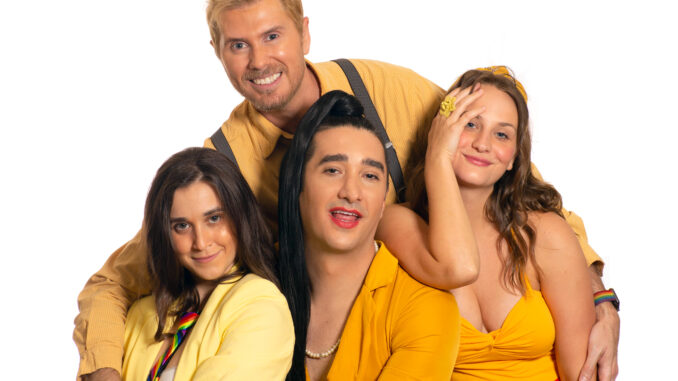 Four people dressed in yellow cuddling